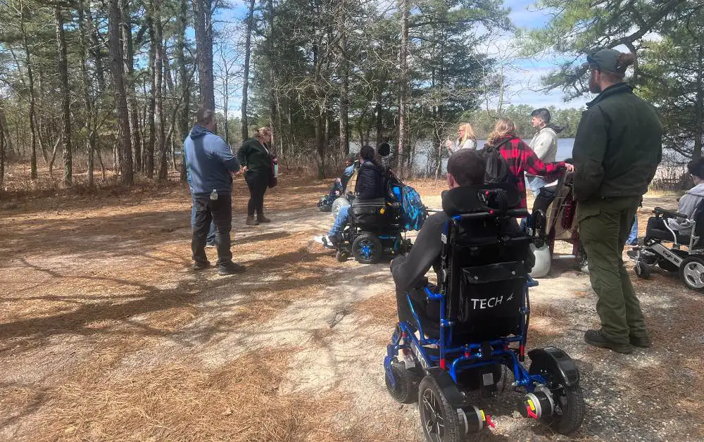 Kingsway group listening to Adventures staff during a program at Atsion recreation area.